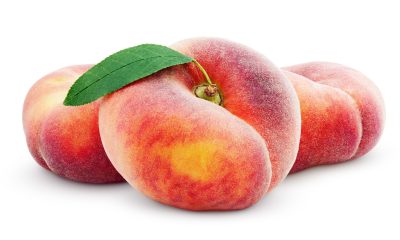 Three chinese flat donut peaches with leaf isolated on white
